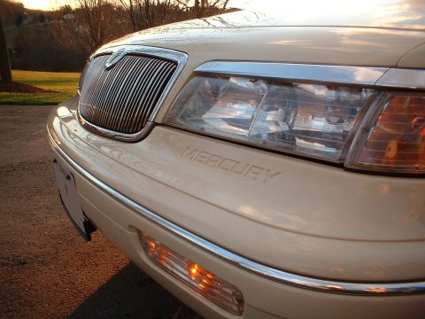 1996 Mercury Grand Marquis - The front of a Mercury Grand Marquis is shown, with the brand name visible on the hood.