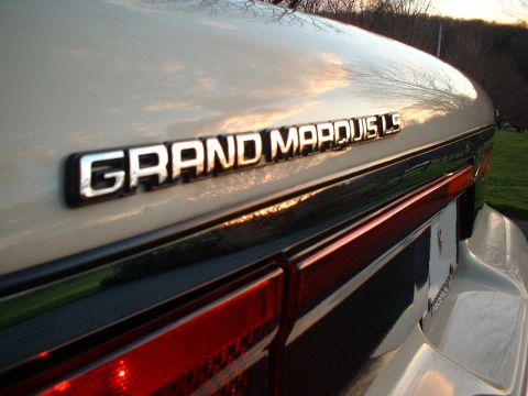 1996 Mercury Grand Marquis - Close-up of the 'GRAND MARQUIS LS' badge on the trunk of a 1996 Mercury Grand Marquis.