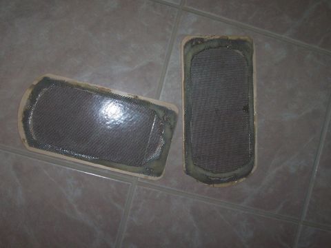 1994 Ford F-150 - Two speaker grilles, likely for a car's interior, are shown on a tiled surface.