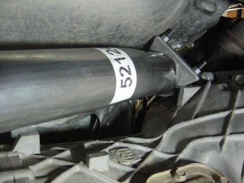 1986 Ford Bronco II - Underside view of a vehicle's exhaust pipe and transmission housing, showing part numbers.