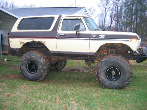 1992 Ford Mustang - This lifted 1978 Ford Bronco features a two-tone cream and brown paint scheme and aggressive off-road tires.