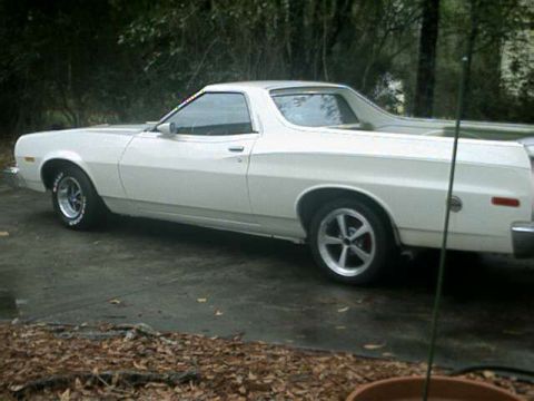 1976 Ford Ranchero - This white coupe utility is shown from its side, parked outdoors on a paved surface.
