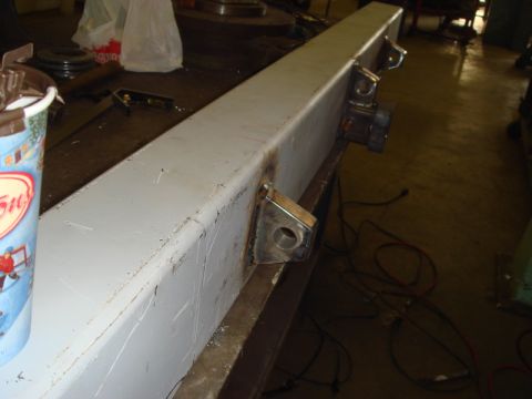 1996 Ford Bronco - A close-up view of a gray metal bumper section, showing welded brackets and mounting points.
