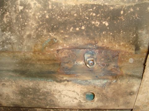 1996 Ford Bronco - Detail of corroded metal structure, possibly from a vehicle's undercarriage, showing signs of wear and tear.