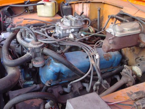 1977 Ford Bronco - Close-up view of an engine bay, showing various components and wiring.