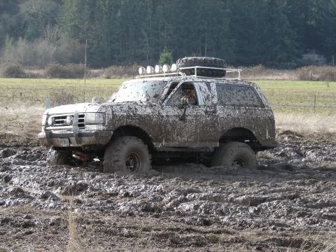 1996 Ford Bronco - This Ford Bronco is completely covered in mud after getting stuck in a muddy field.