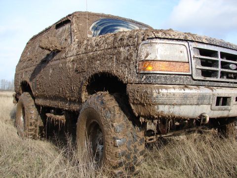 1996 Ford Bronco - This 1996 Ford Bronco is heavily covered in mud after off-roading.