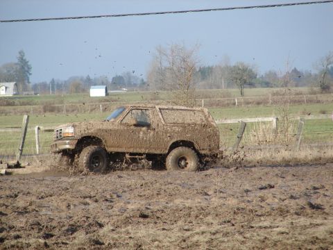 1996 Ford Bronco - This 1996 Ford Bronco is covered in mud after driving through a very muddy field.