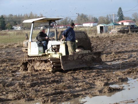 1996 Ford Bronco - Tractor stuck in mud with two people aboard.