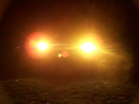 2001 Dodge 1500 - Headlights are the primary subject, obscuring any vehicle details.