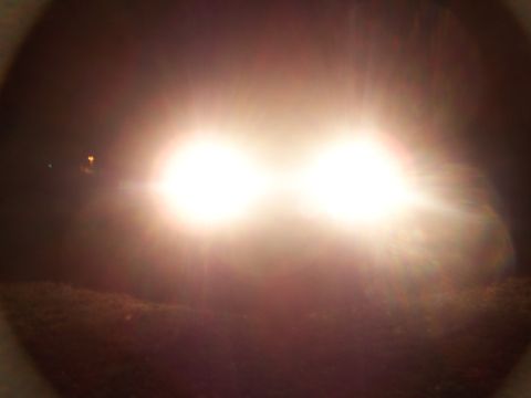 2001 Dodge 1500 - Bright headlights illuminate the darkness, with the Supermotors.net logo visible in the lower right corner.