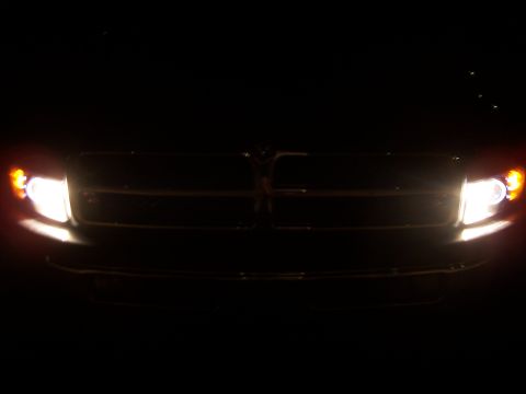 2001 Dodge 1500 - Front view of a 2001 Dodge 1500 with headlights on at night.