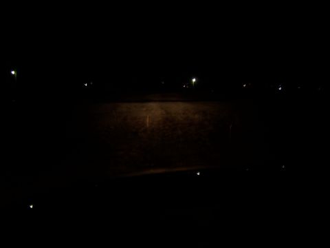2001 Dodge 1500 - A dark road is visible at night, with distant lights and a watermark at the bottom right.