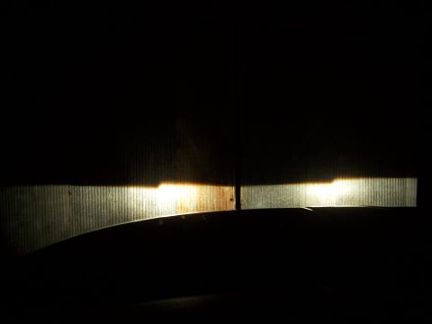 2001 Dodge 1500 - Headlight beams are projected onto a ribbed surface in the dark.
