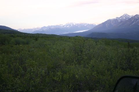 2003 Jeep TJ - Expansive view of a glacial valley surrounded by mountains under a hazy sky.