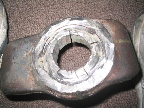 1991 Ford Bronco - A metal component, possibly a differential housing, with a machined opening and partial numerical inscription.