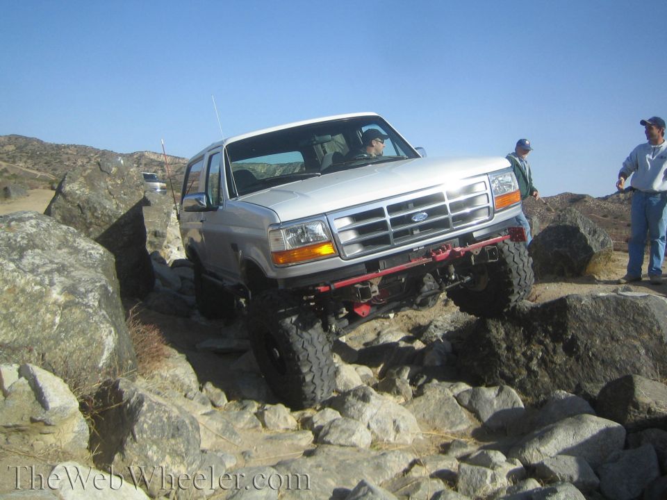 White 1992 Ford Bronco navigating rocky terrain
