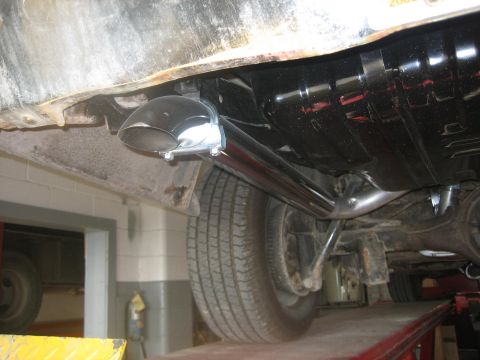 1976 Ford Ranchero - Close-up view of a vehicle's exhaust system and undercarriage components.