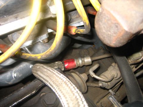 1976 Ford Ranchero - Close-up view of engine bay components, including spark plug wires and hoses.
