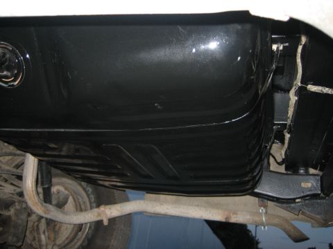 1976 Ford Ranchero - Close-up of a vehicle's gas tank and exhaust system from below.