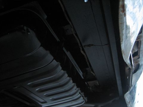1976 Ford Ranchero - The underside of a vehicle, focusing on the fuel tank and frame components.