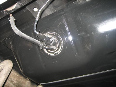 1976 Ford Ranchero - Fuel tank and lines visible from underneath a vehicle.