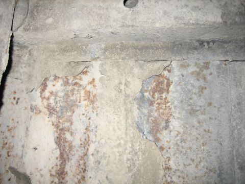 1976 Ford Ranchero - The underside of a vehicle shows significant rust and deterioration.