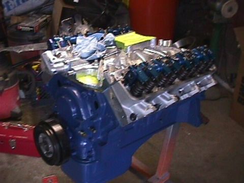 1963 Ford Fairlane - A blue engine block with chrome valve covers and blue valve springs is shown, possibly undergoing restoration or modification.