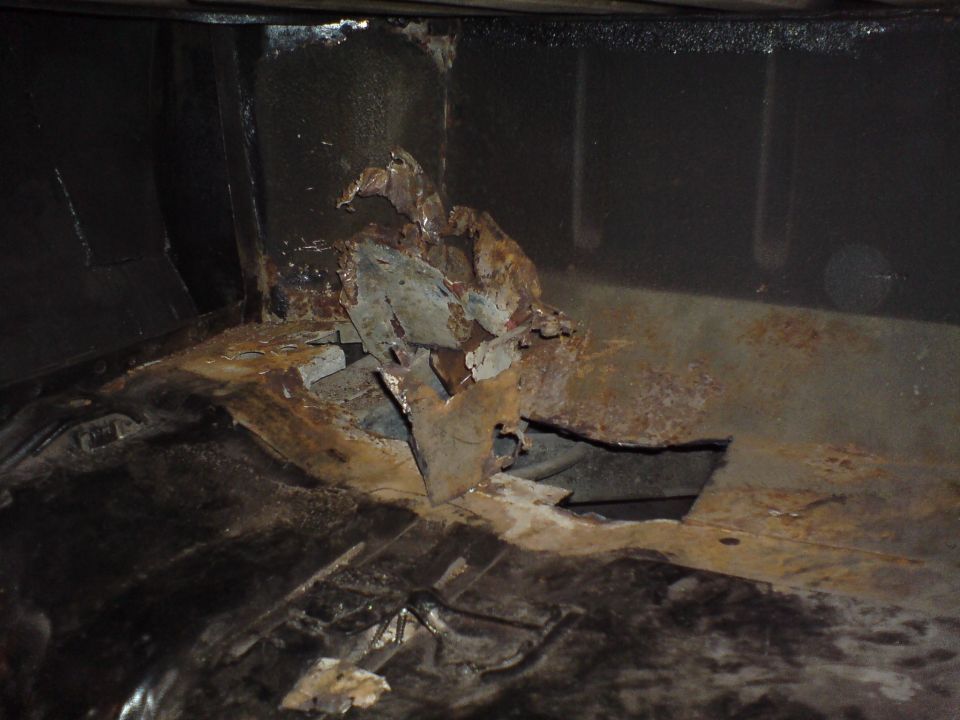 Severe rust-through corrosion in a vehicle floor or body cavity