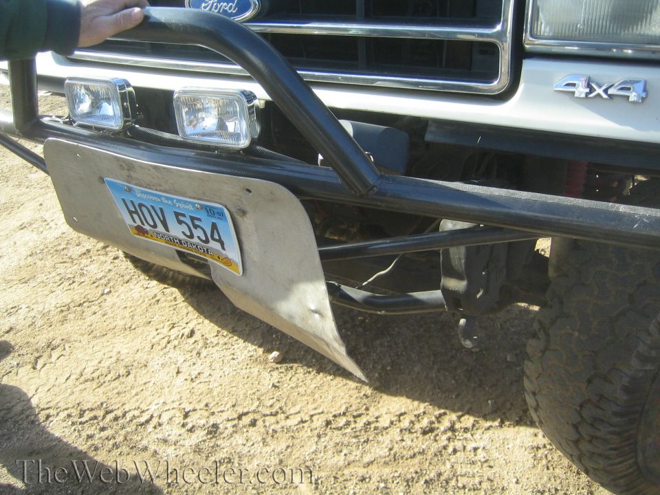 Front of a Ford truck with a brush guard, auxiliary lights, and a North Dakota license plate