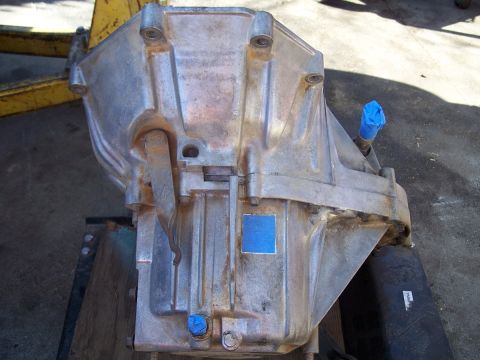 1992 Ford Taurus - Close-up of an aluminum transmission housing, showing its metallic casing and taped fittings.