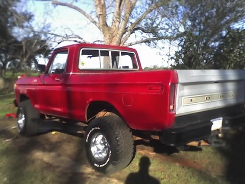 1979 Ford F-150 - This lifted Ford pickup truck is shown from the rear quarter angle, with a silver tailgate.