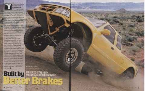 1984 Ford Bronco - This modified truck is shown tackling a steep, dusty incline in a desert landscape.