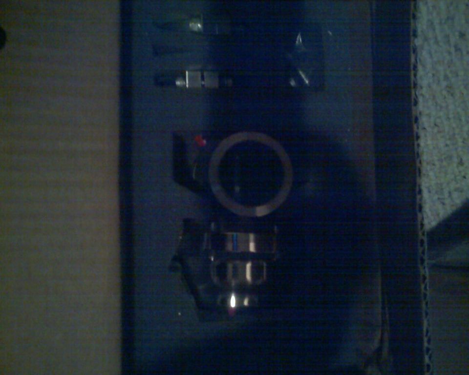 Turbo kit components in packaging, including a circular housing