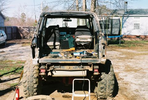 1978 Ford Bronco - This 1978 Ford Bronco is missing its top and has tools laid out in the cargo area.
