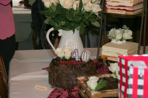 1966 Ford Bronco - A birthday celebration features multiple cakes, flowers, and decorations, including a prominent '40' candle.