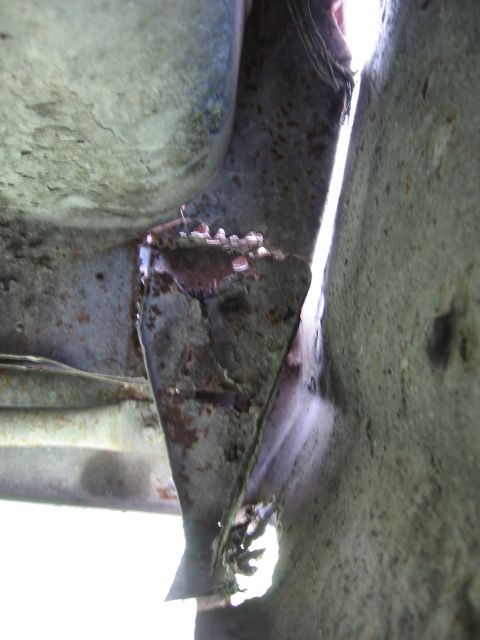 1974 Ford F-100 - This image shows significant rust and damage to a vehicle's frame, with a watermark for SuperMotors.net visible.