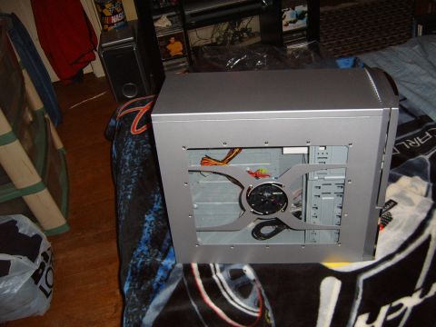 1993 Ford Bronco - A silver computer case sits on a blanket with a car graphic. The internal components are visible.