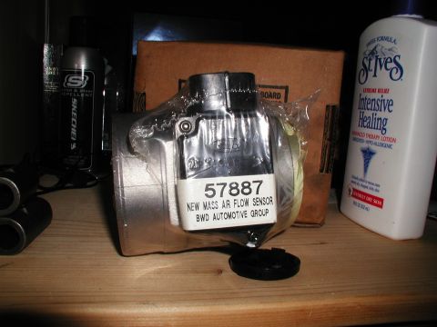 1992 Ford Taurus - A new mass air flow sensor is shown, labeled with part number 57887 and BWD Automotive Group.