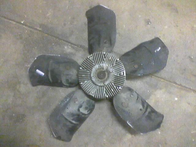 Radiator fan with five black blades and silver hub