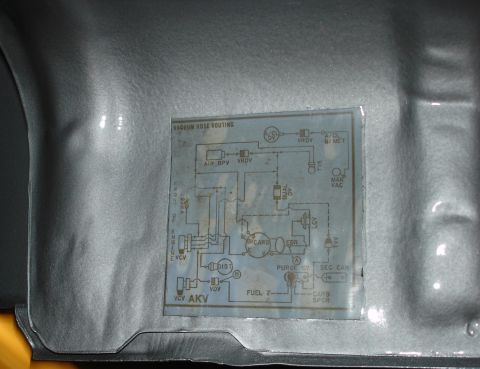 1979 Ford Bronco - A vacuum hose routing diagram is visible on the interior panel of a vehicle.