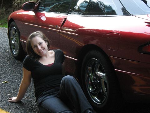 1997 Ford Probe - A woman poses next to a red 1997 Ford Probe coupe.