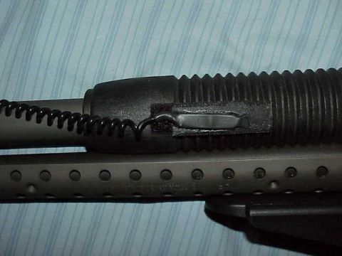 1993 Ford Bronco - This image shows a close-up view of a gun's forend, a coiled wire attached to the barrel shroud.