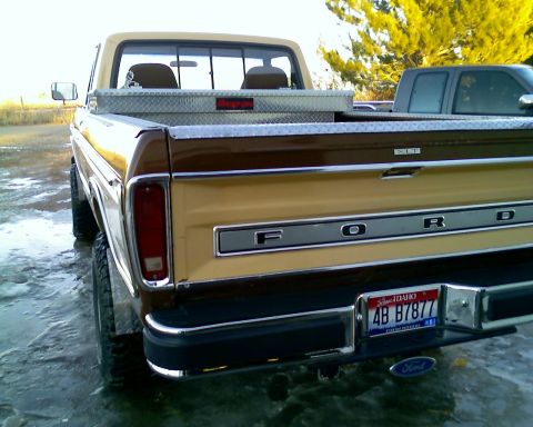 1979 Ford F-150 - Rear view of a 1979 Ford F-150 pickup truck with a toolbox and another vehicle behind it.