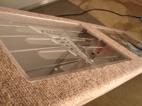 1996 Ford Bronco - Car audio amplifier with Kicker logo, wrapped in carpet, likely part of a custom stereo system.