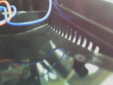 1993 Ford C-350 (Centurion Conversions) - Close-up view of wires and ventilation slots within a dark interior space.