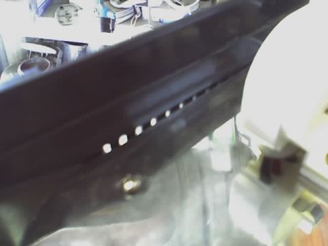 1993 Ford C-350 (Centurion Conversions) - Close-up view of black plastic trim a series of small, circular perforations.