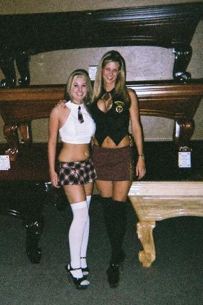 1991 Ford Bronco - Two women pose in front of pool tables, dressed in outfits resembling school uniforms.