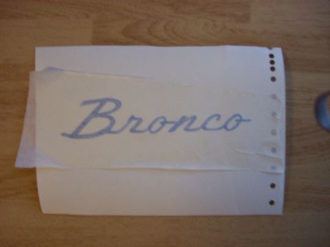 1967 Ford Bronco - A decal with the word "Bronco" is shown on a piece of paper.