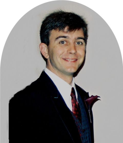 1965 Ford Mustang - Portrait of a man dressed in formal wear, smiling at the camera.